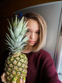 Portrait of woman with fruits