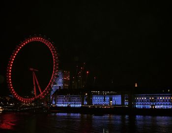 View of illuminated ferris wheel at night