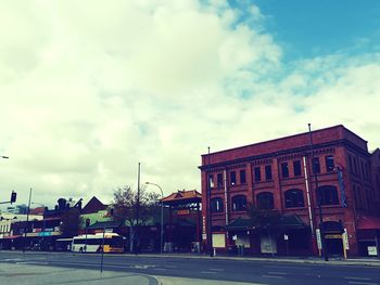 View of buildings against cloudy sky