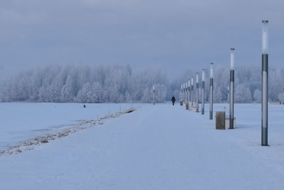 Snow covered field against sky