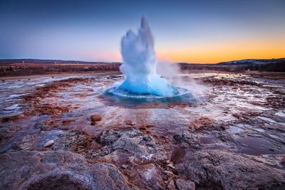 View of hot spring against sky during sunset