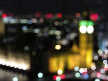 Defocused image of illuminated city at night