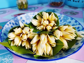 High angle view of flowers in plate on table