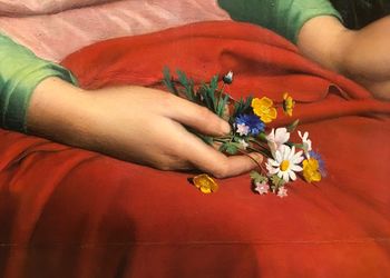 Midsection of woman holding flower bouquet