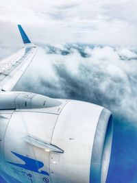 Airplane wing against sky