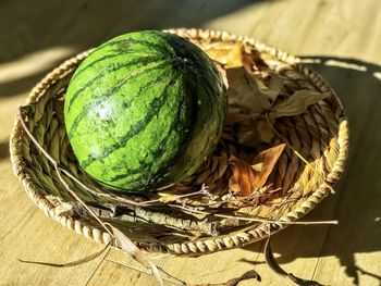 High angle view of fruits in basket on table