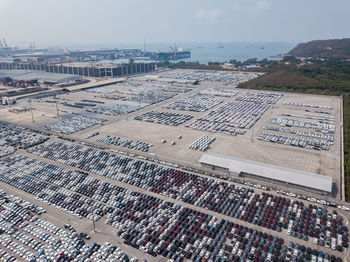 High angle view of parking lot and buildings in city