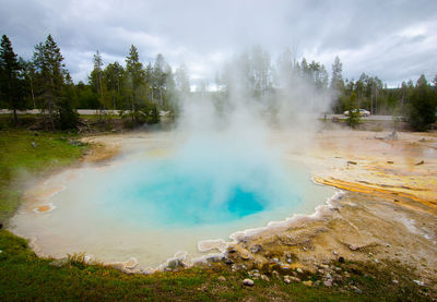 View of geyser on landscape