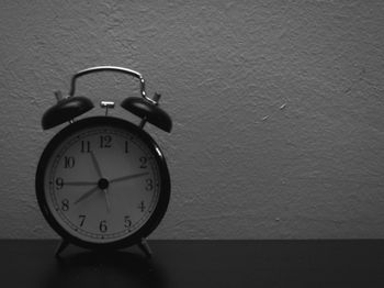 Close-up of clock on table