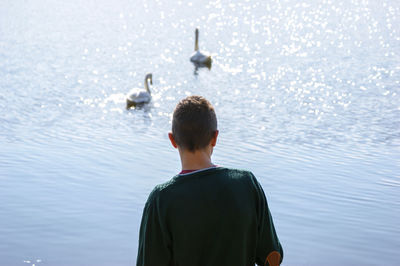 Rear view of man looking at sea