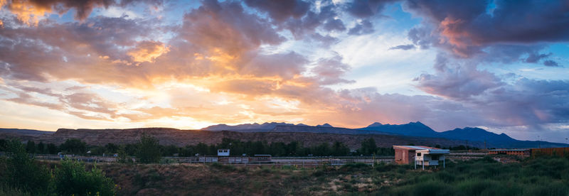 Scenic view of field against sky during sunset