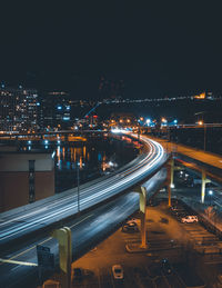 High angle view of light trails on road at night