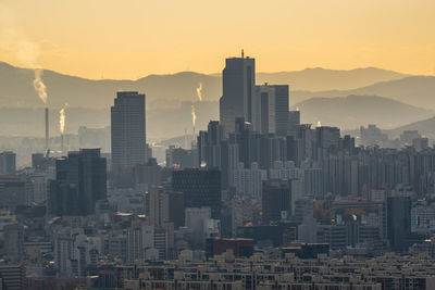 Cityscape against sky during sunset