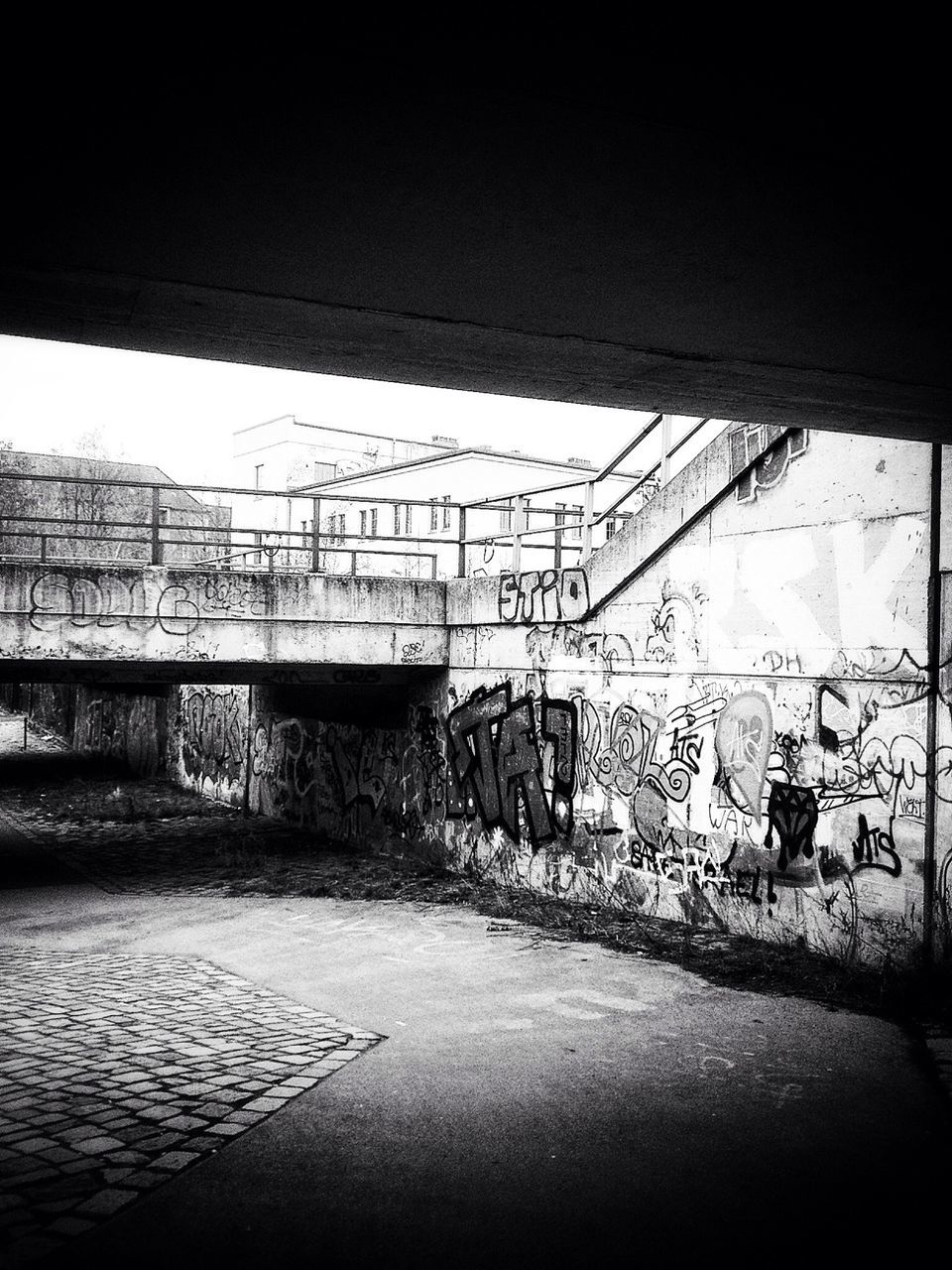 architecture, built structure, wall - building feature, graffiti, abandoned, building exterior, street, damaged, wall, obsolete, sunlight, house, deterioration, no people, day, outdoors, building, road, empty, run-down