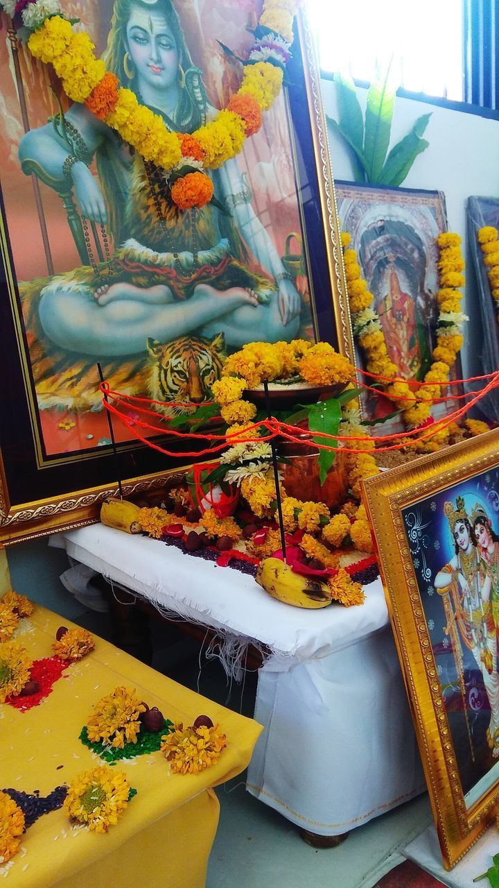 CLOSE-UP OF PEOPLE ON TABLE AT TEMPLE