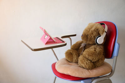 High angle view of stuffed toy on chair