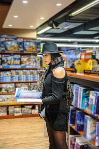 Woman standing in book store