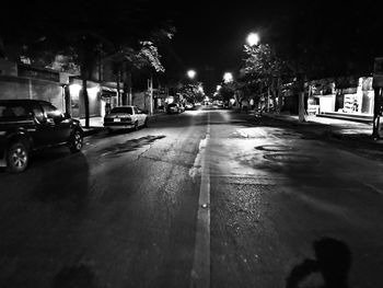 Cars on road in city at night