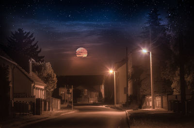 Digital composite image of illuminated street lights at night