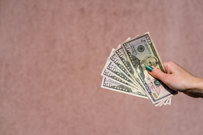 Close-up of hand holding paper