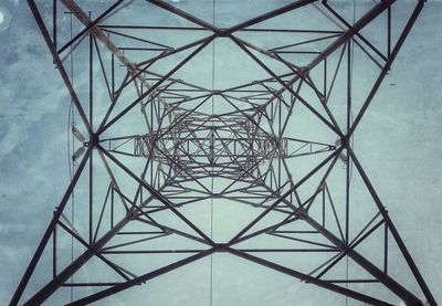 Low angle view of electricity pylon against sky