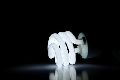 Close-up of illuminated light bulb