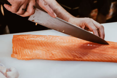 Midsection of person holding fish