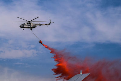 Low angle view of airshow against sky