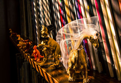 Statue in illuminated carousel at night