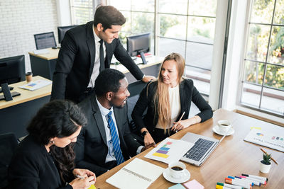 Smiling business people working in office