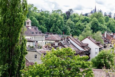 Houses in town against sky