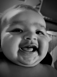 Close-up portrait of smiling cute baby girl