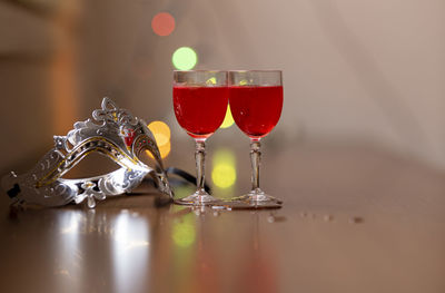 Close-up of wine glasses on table