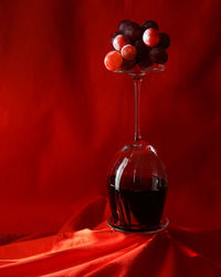 Close-up of red wine glass on table