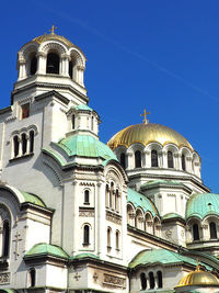 Low angle view of church against blue sky