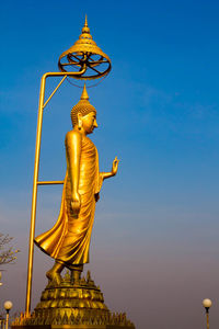 Statue of temple against blue sky