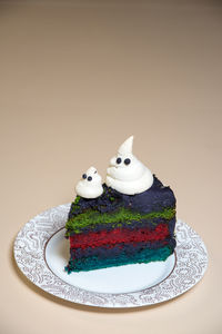 High angle view of cake on table against white background