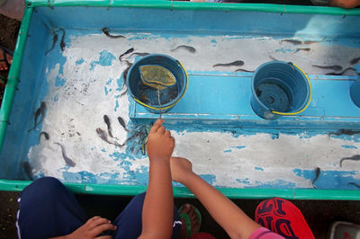  the atmosphere of the children's toy booth playing with catfish at the sunday morning market