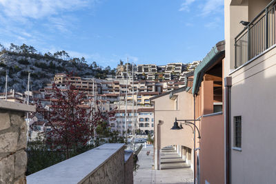 Buildings in town against sky