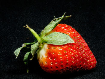 Close-up of strawberry against black background