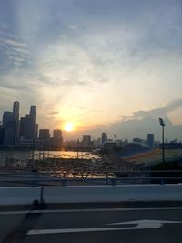 City against sky during sunset