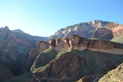 Scenic view of rocky mountains at grand canyon national park against clear sky