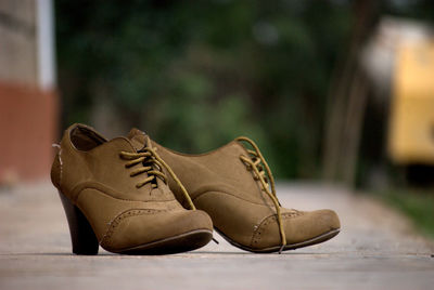 Close-up of shoes on ground