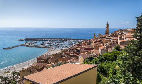 Aerial view of the historic center of menton with the beautiful basilica and blue sea