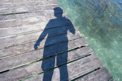 High angle view of boardwalk by swimming pool