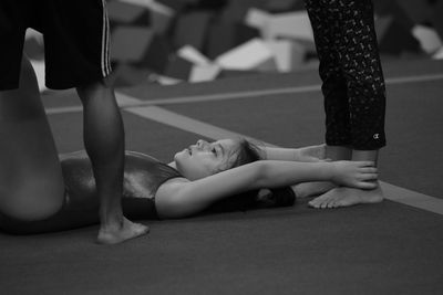 Low section of woman standing on ground