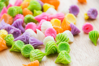 Close-up of multi colored candies on table