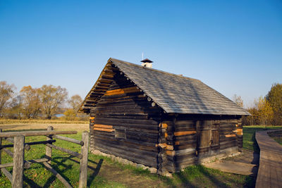 Large old log house in autumn in the village