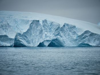 Scenic view of frozen sea against sky