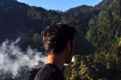 Close up of a young man in forest